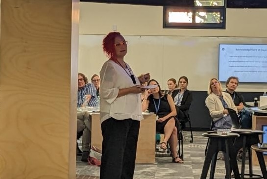 Natalie Walker delivers a workshop to a room of people